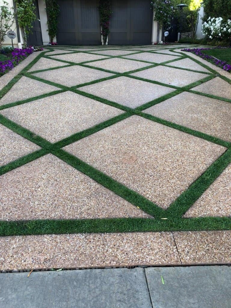 Contemporary garden pathway with geometric gravel and grass pattern.